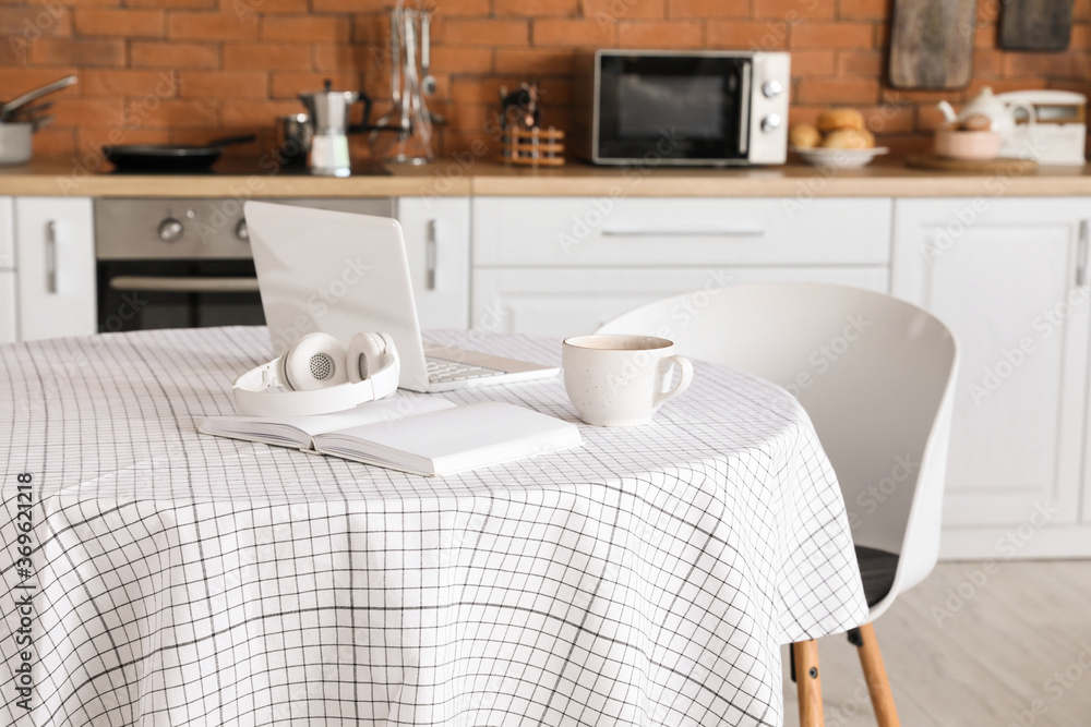 Dining table in interior of modern kitchen