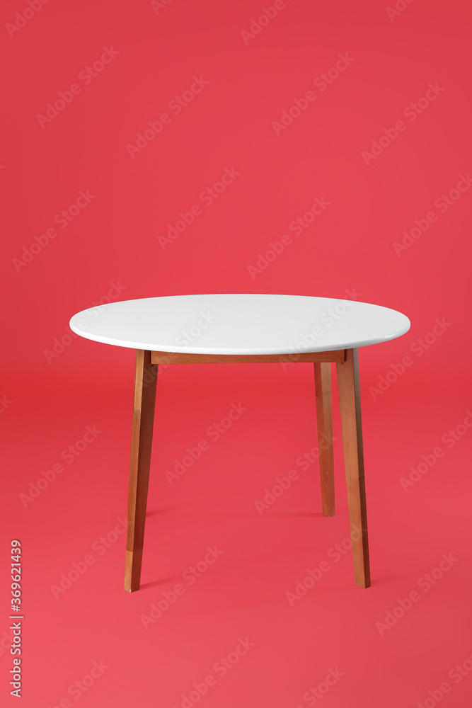 Dining table on color background