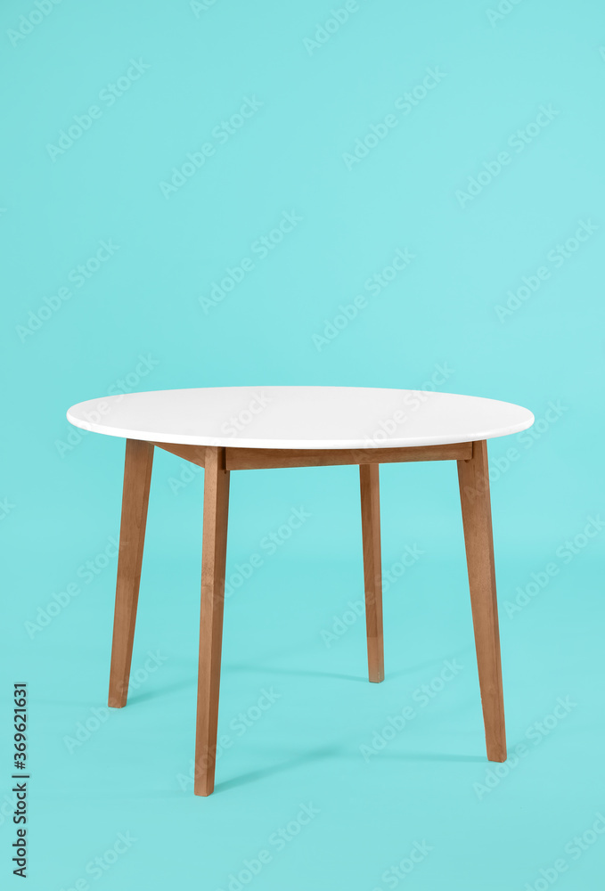 Dining table on color background