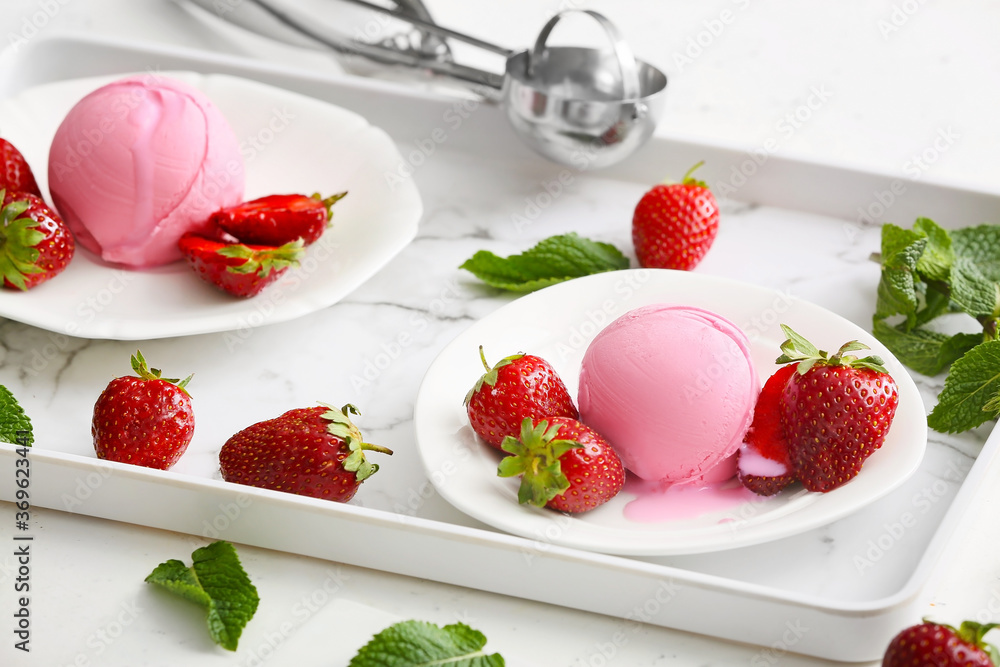 Tasty strawberry ice cream on tray