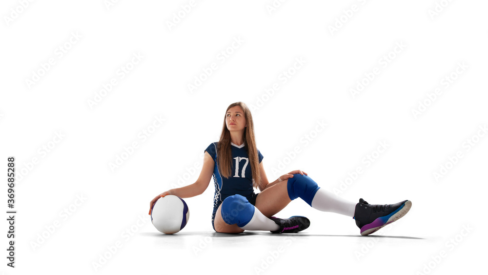 Female professional volleyball players in action on white background.