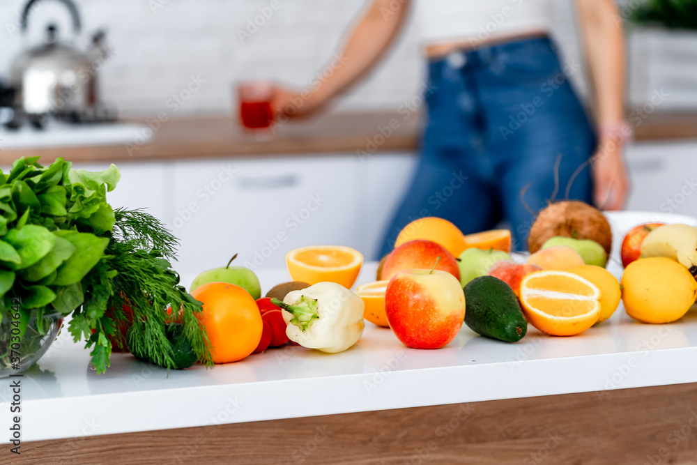 Healthy food, fruit, vegetable, berries, leaf vegetable on a table in a kitchen background. Organic 