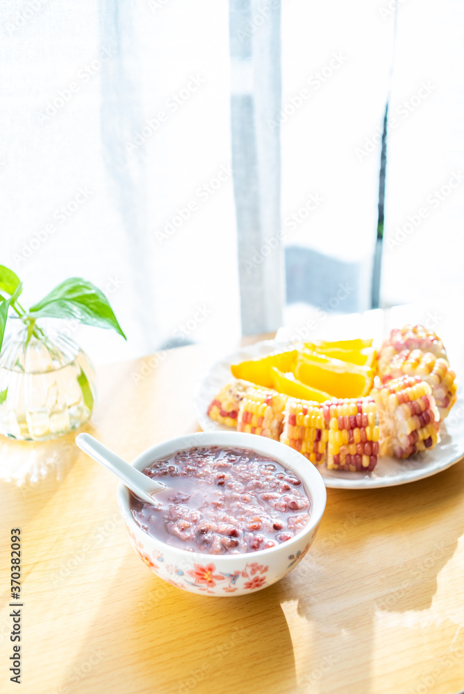 Chinese nutritious breakfast with red bean porridge and corn