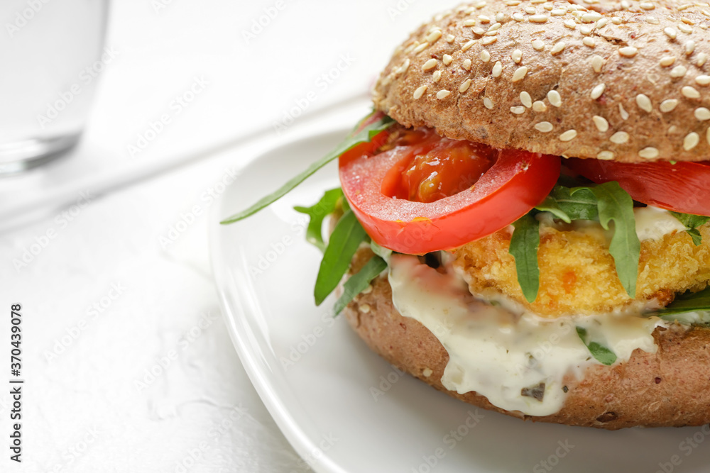 Plate with tasty vegan burger on white background, closeup