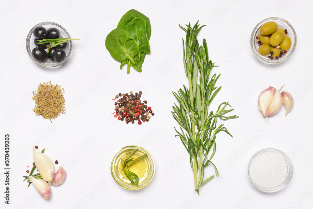 Rosemary oil and spices on white background