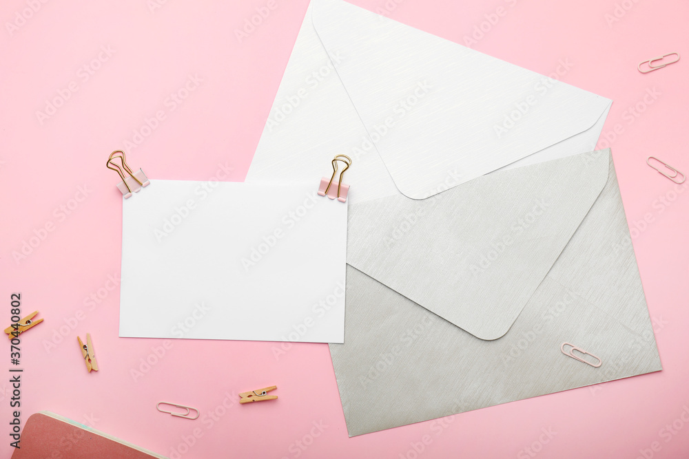 Blank card and envelopes on color background