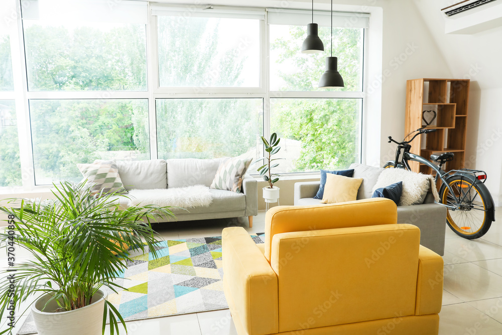 Stylish interior of living room with comfortable furniture