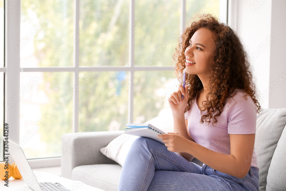 Young woman learning at home