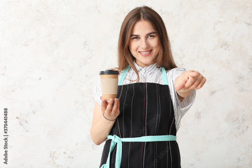 Female barista on light background