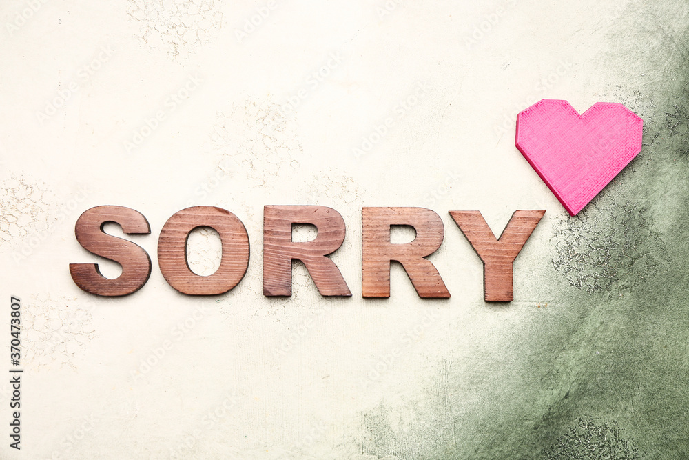 Word SORRY on light background