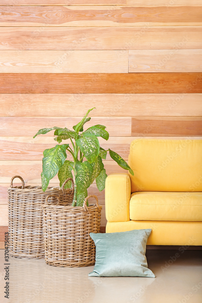 Interior of modern room with wicker baskets and armchair