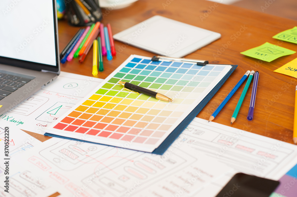 Color swatch for designing websites and mobile apps on the desk.