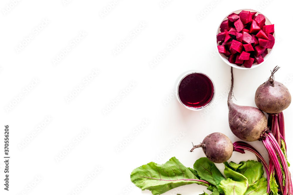 Top view of beet harvest. Green tops, slices, juice top-down space for text