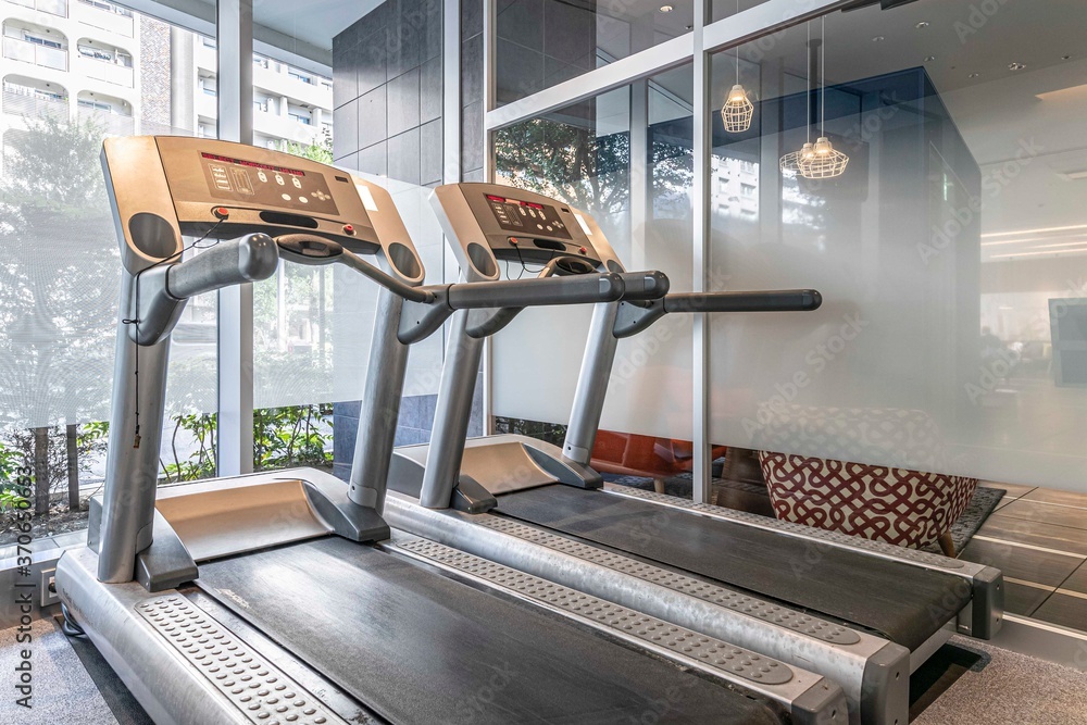 Two empty treadmills for jogging in the gym