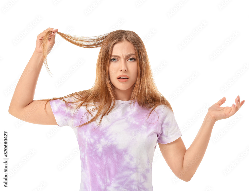 Stressed woman with hair problem on white background