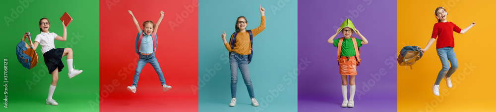 Kids with backpacks on colorful background