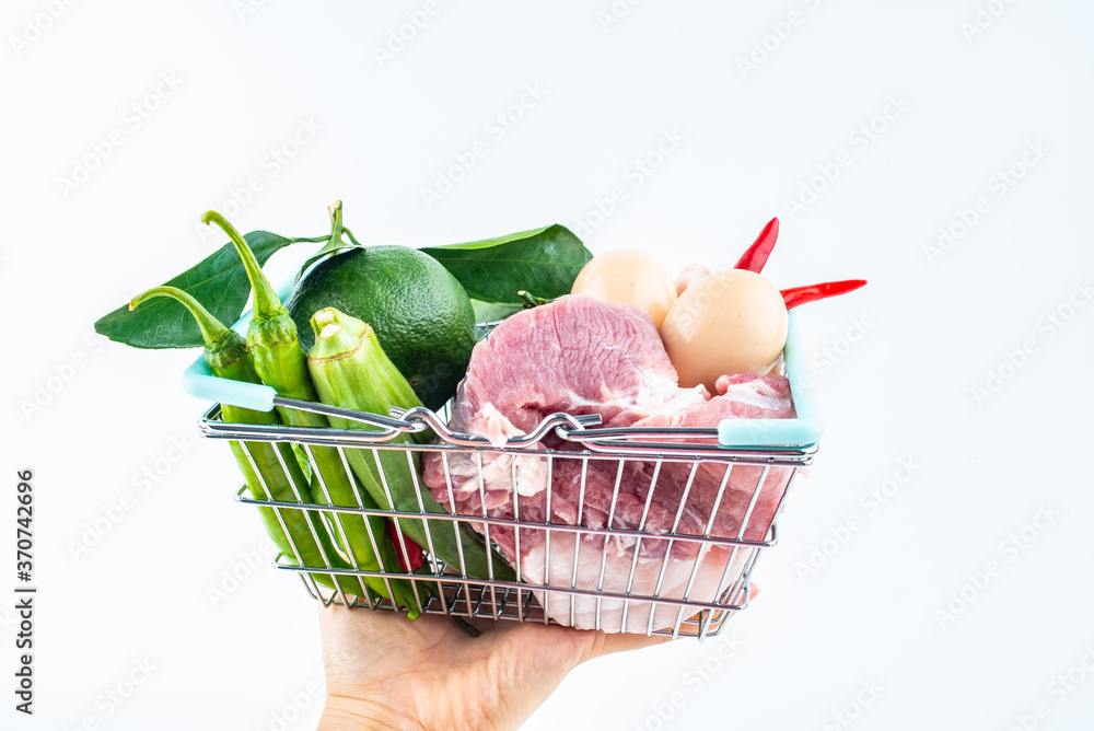 Vegetable basket full of pork, vegetables and fruits