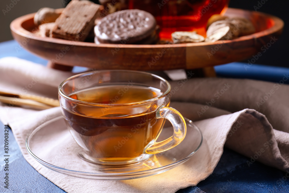 Cup of hot tea on table