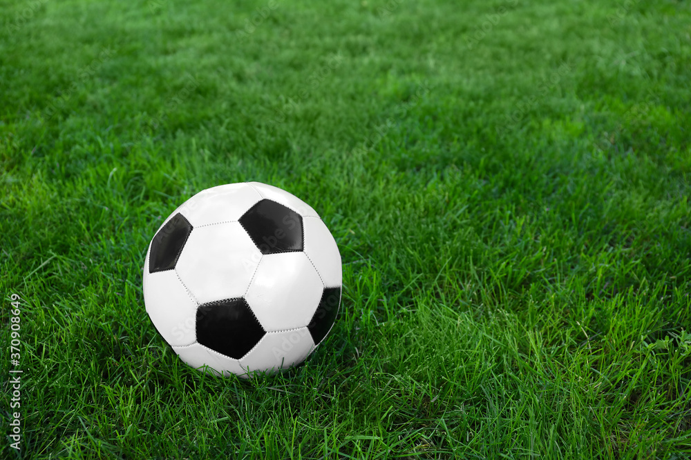 Soccer ball on green grass outdoors