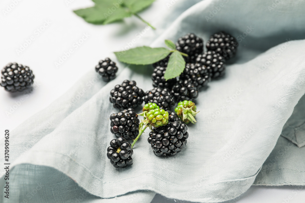 Ripe tasty blackberry on napkin