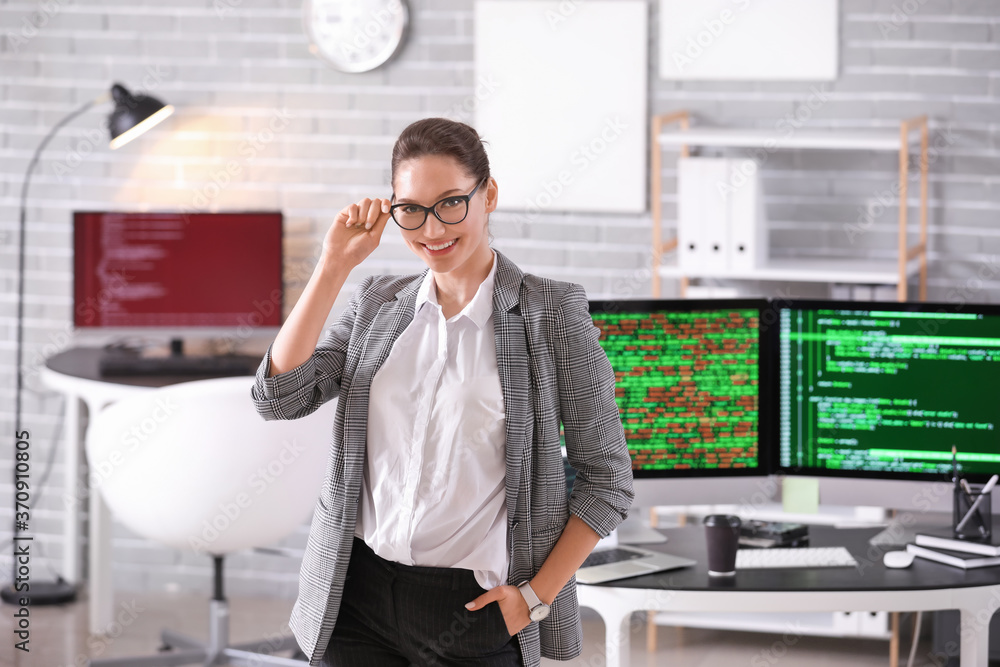 Portrait of female programmer in office