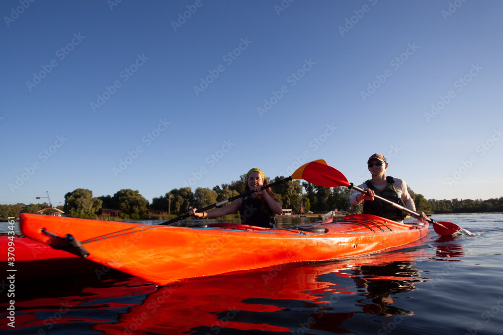 Kayaking. People paddling a kayak. Canoeing. Paddling.