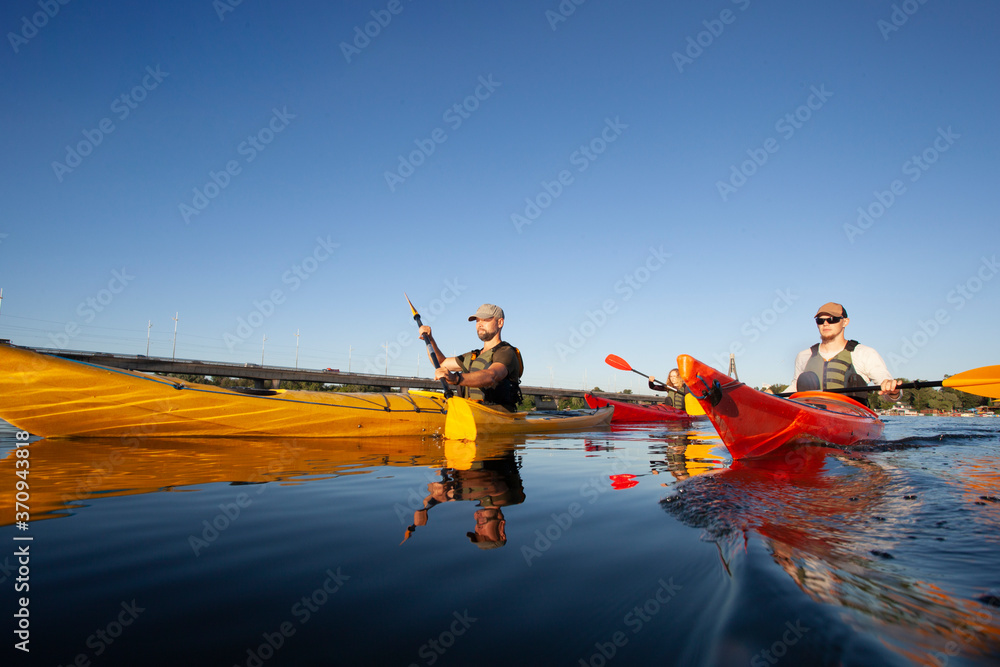 Kayaking. People paddling a kayak. Canoeing. Paddling.