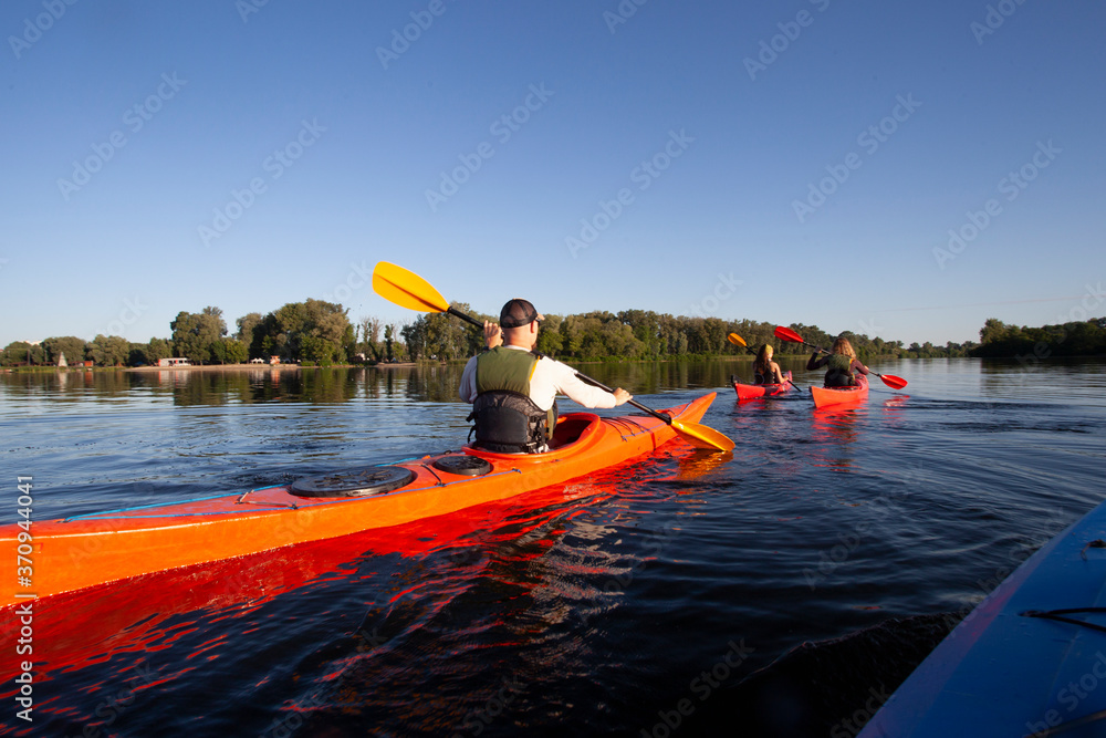 Kayaking. People paddling a kayak. Canoeing. Paddling.