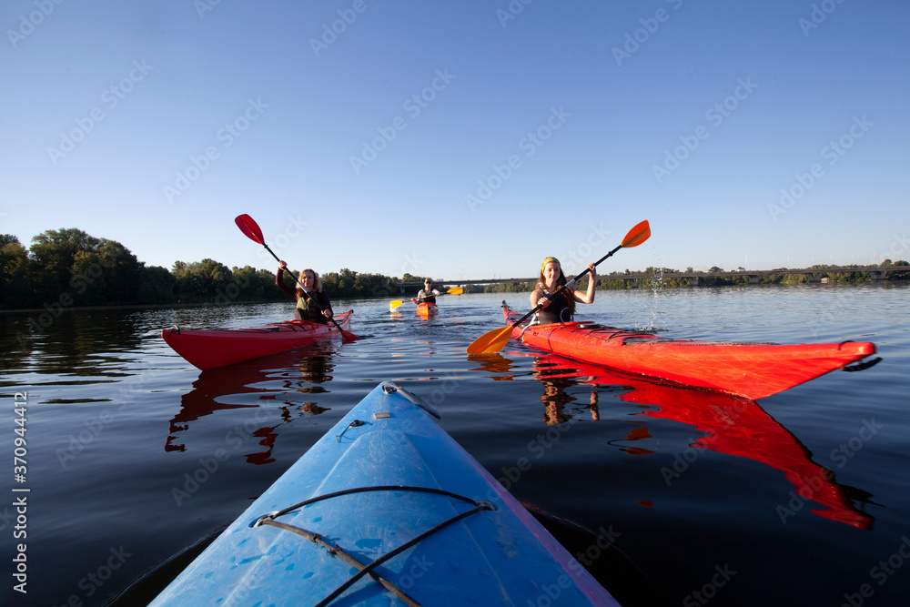 Kayaking. People paddling a kayak. Canoeing. Paddling.