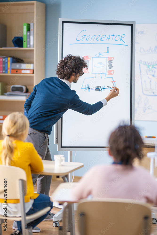 Elementary School Physics Teacher Uses Interactive Digital Whiteboard to Show to a Classroom full of