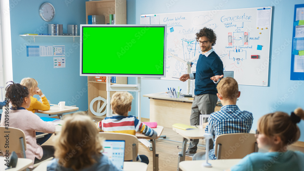 Elementary School Physics Teacher Uses Interactive Digital Whiteboard With Green Screen Mock-up Temp