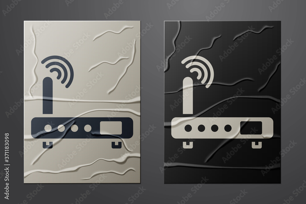 白色路由器和wi-fi信号图标被隔离在皱巴巴的纸背景上。无线以太网调制解调器ro