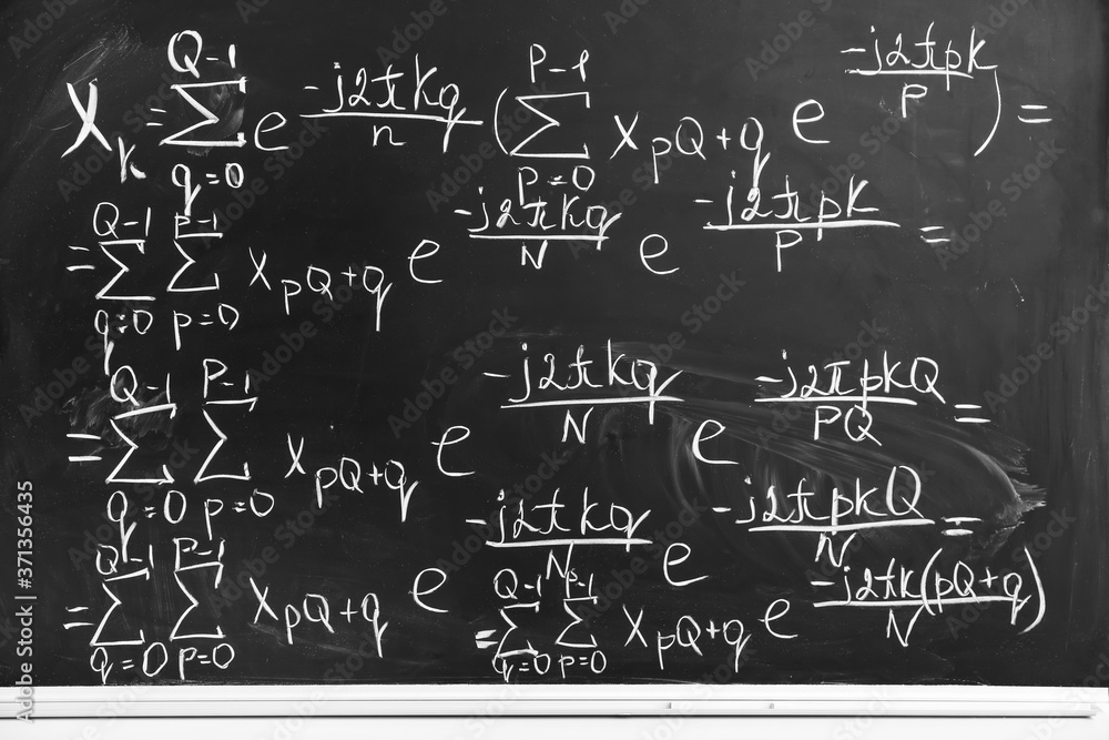 Blackboard with written maths formulas