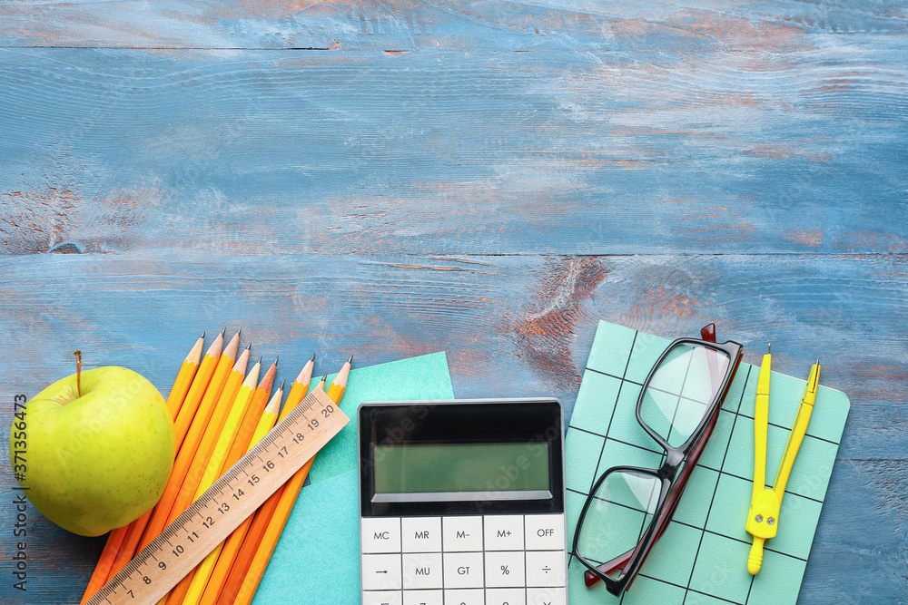 Set of school stationery on wooden background