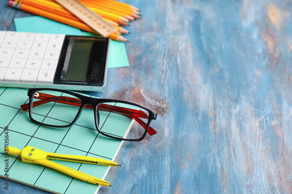 Set of school stationery on wooden background