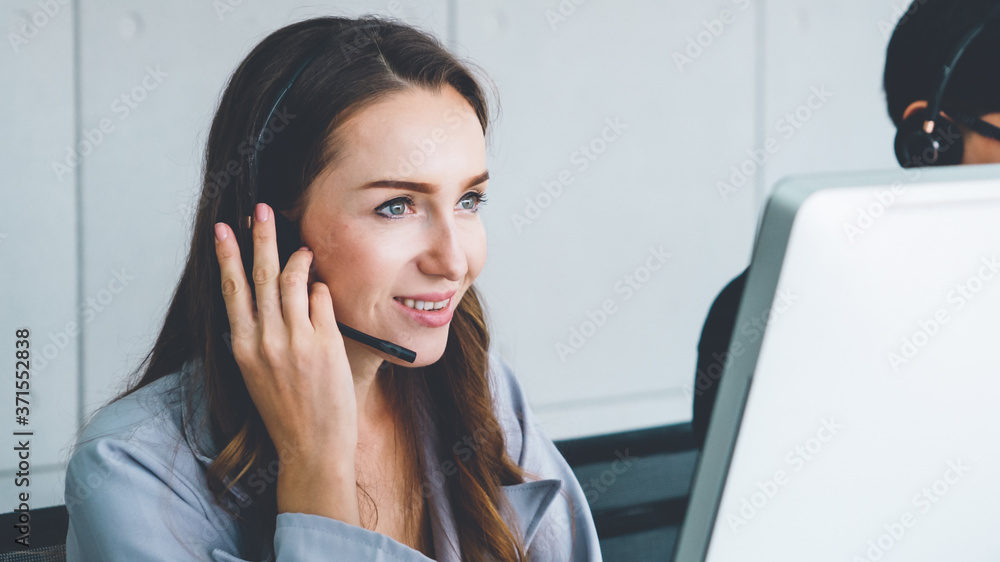 Business people wearing headset working in office to support remote customer or colleague. Call cent