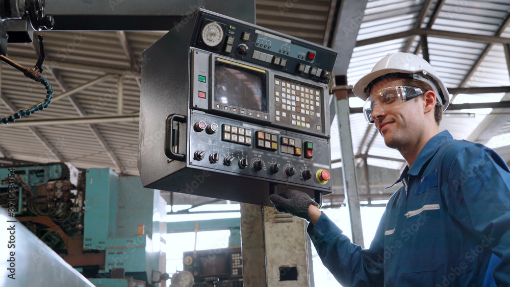 Smart factory worker using machine in factory workshop . Industry and engineering concept.