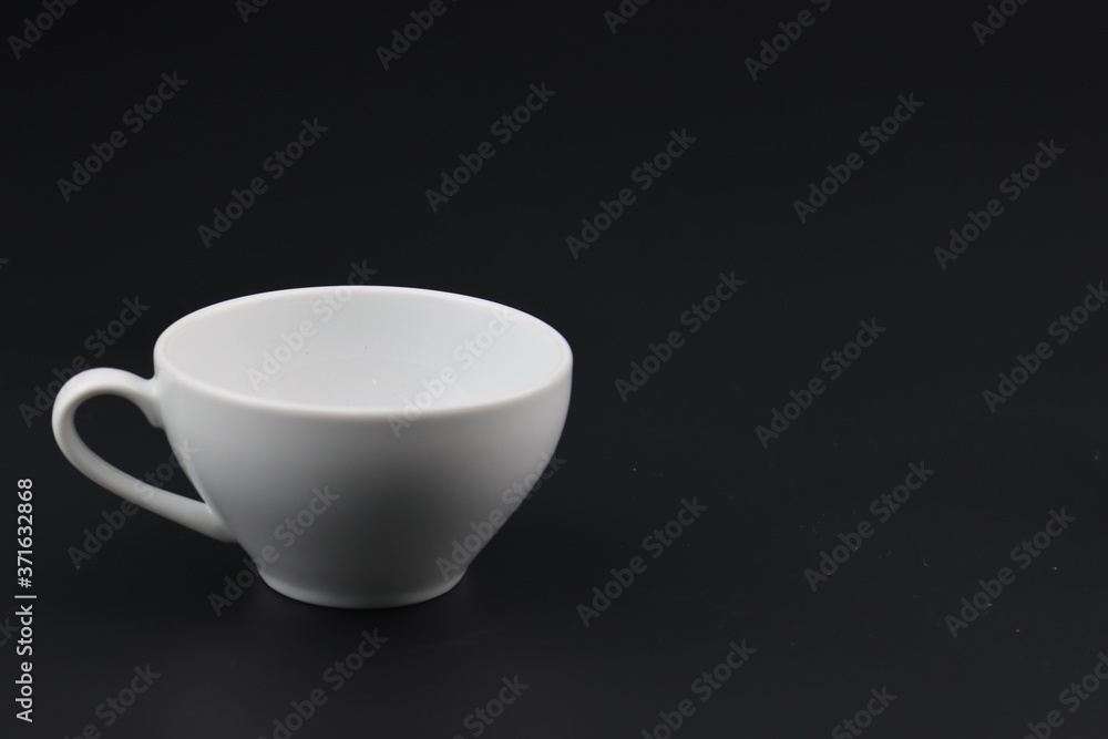 Empty white coffee cup on black color background