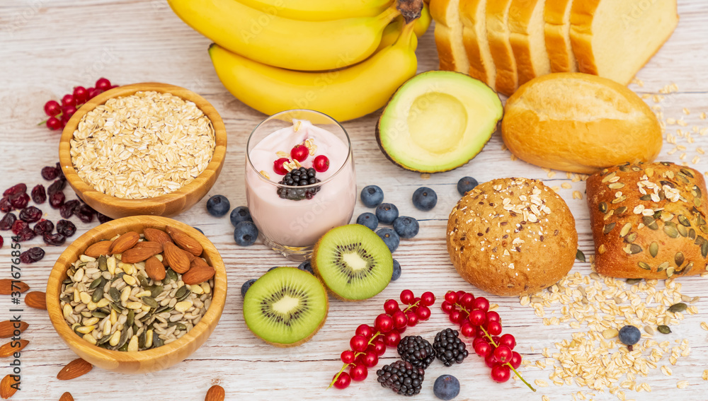 Group Fruits Breakfast with bread Whole grains and nuts, yogurt mix with Cherry , banana, avocado in