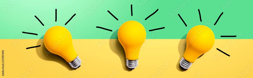 Three yellow light bulbs - flat lay from above