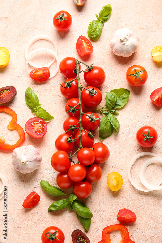 Composition with fresh cherry tomatoes, herbs and spices on color background