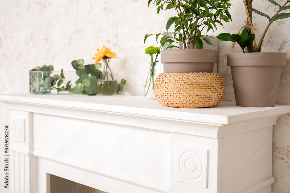 Modern fireplace near wall in room, closeup