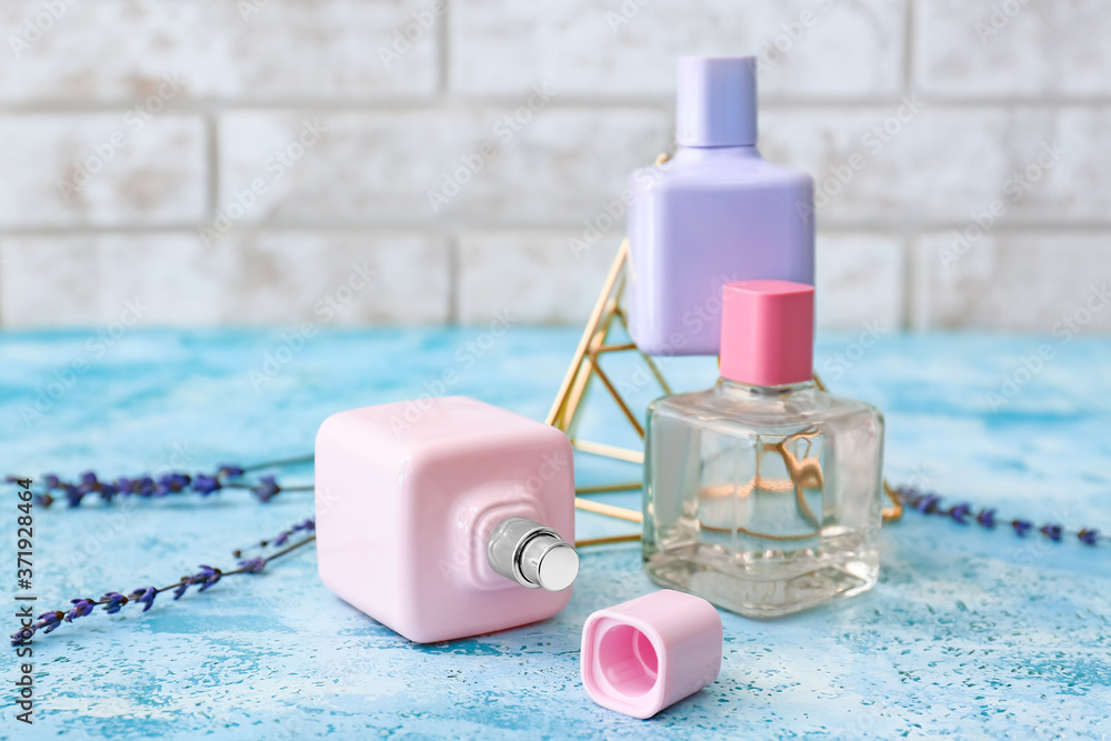 Bottles of floral perfumes on table