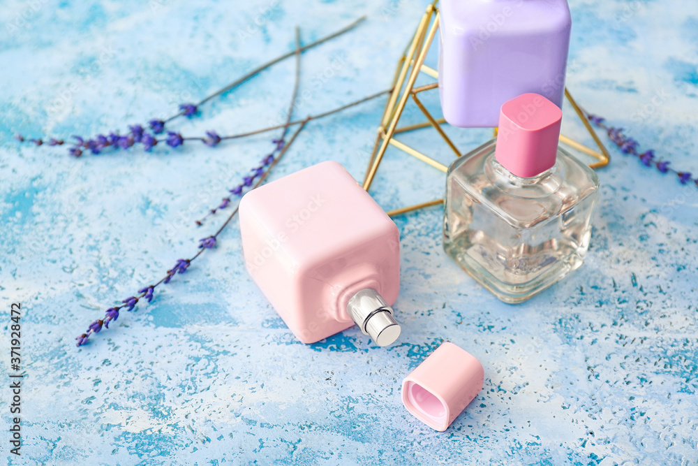 Bottles of floral perfumes on table