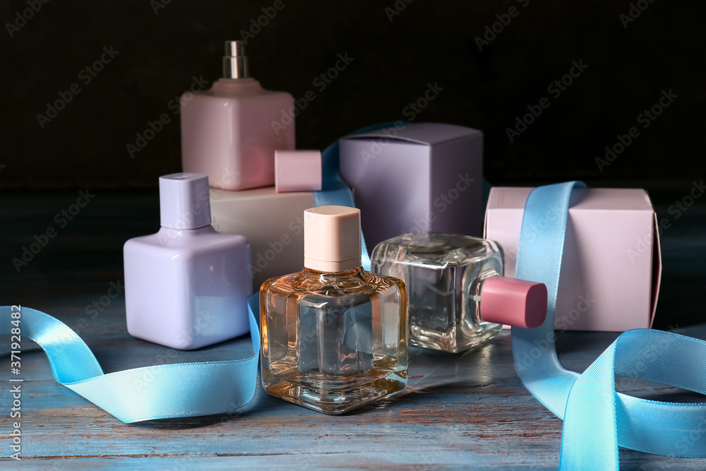 Bottles of different perfumes on table