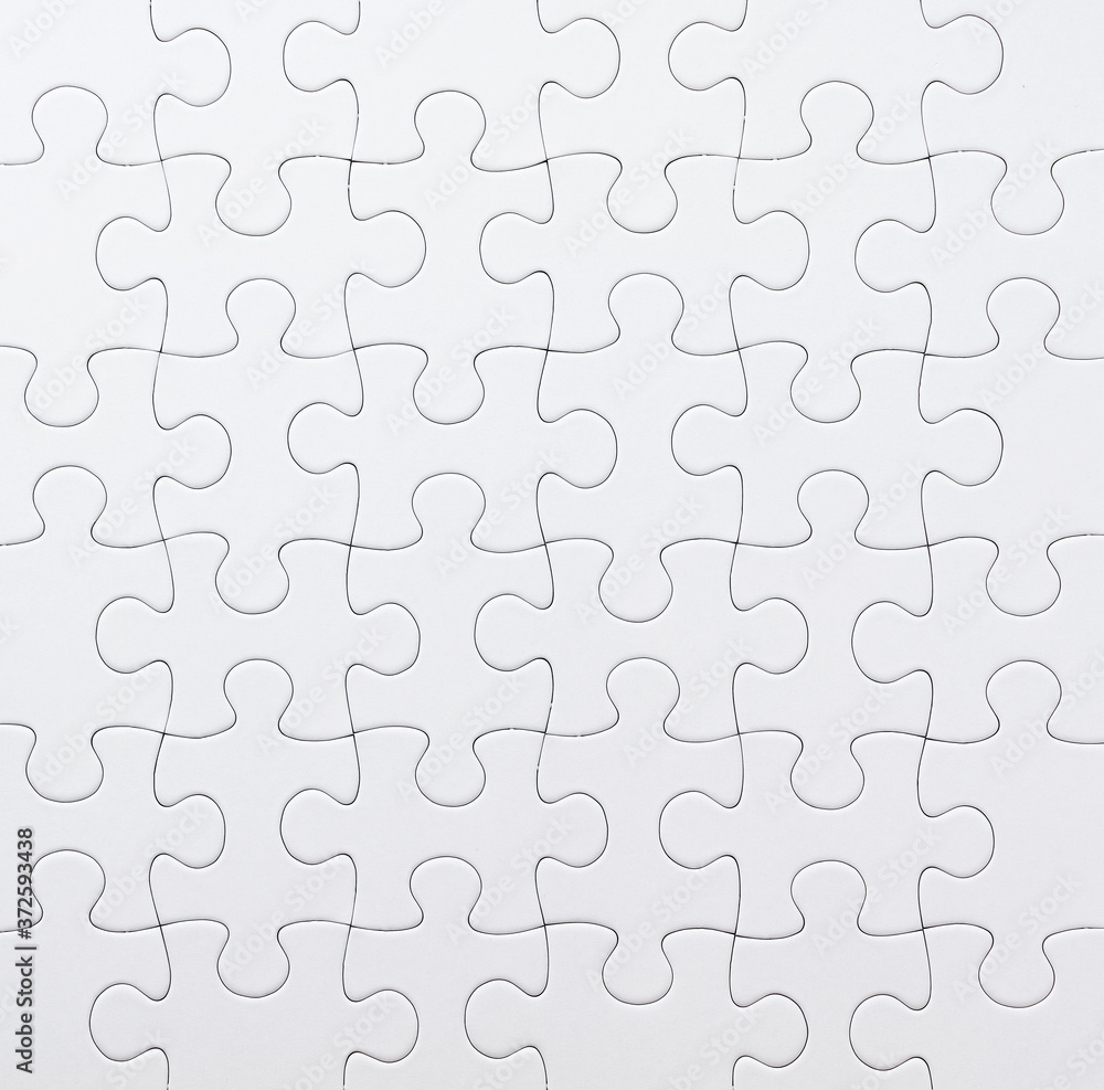 White jigsaw puzzle viewed from above..