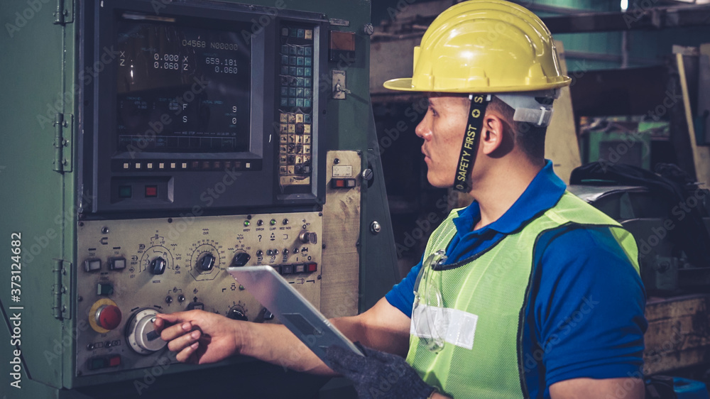 Smart factory worker using machine in factory workshop . Industry and engineering concept.