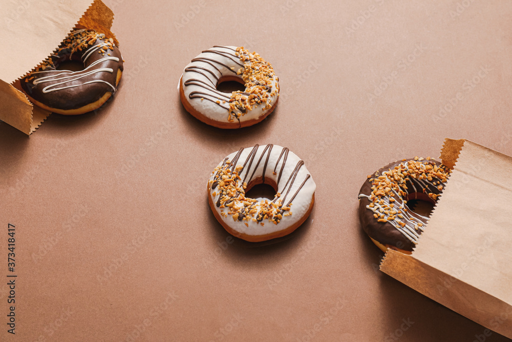 Sweet tasty donuts on color background