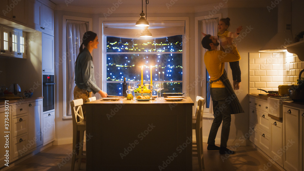 Happy Family of Three Cooking and Having Dinner Together. Mother Prepares Food, Father Hugs Cute Lit