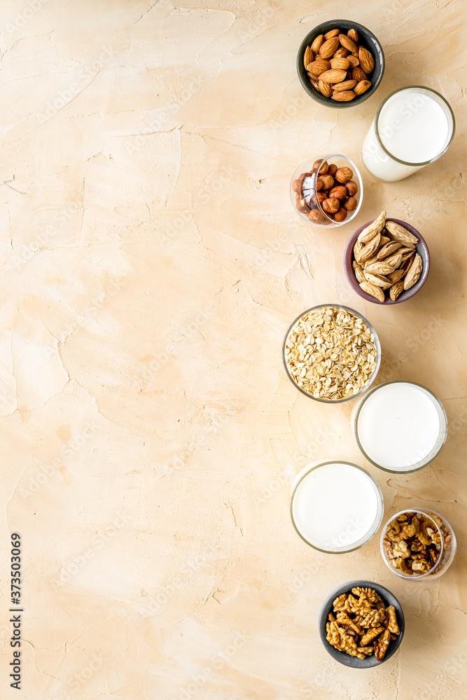 Glasses of non-dairy vegan milk - lactose free nuts and grain drink. Top view